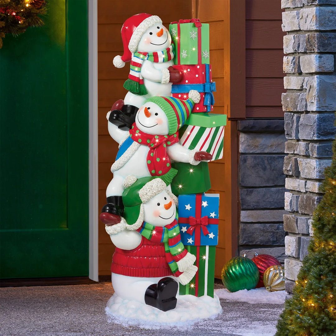 Trio de bonshommes de neige et leur tour de cadeaux
